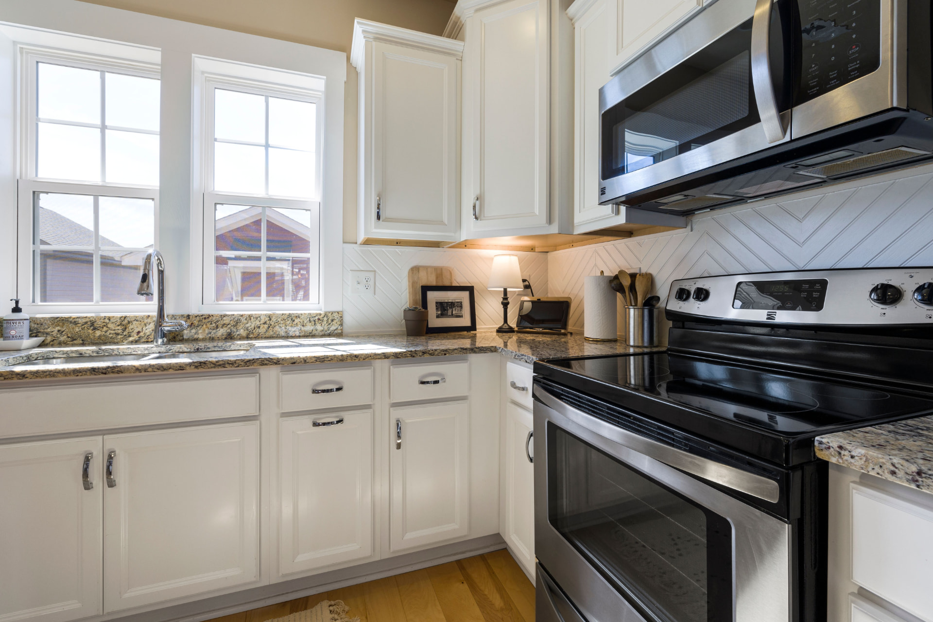 Detailed kitchen counters, sink and range after cleaning