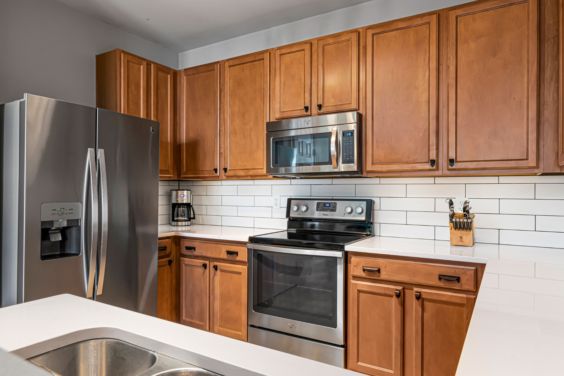 Kitchen with wood cabinets and subway tile backsplash